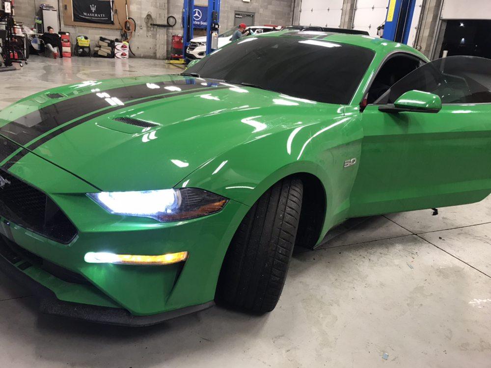 Green Ford Mustang GT with window tint