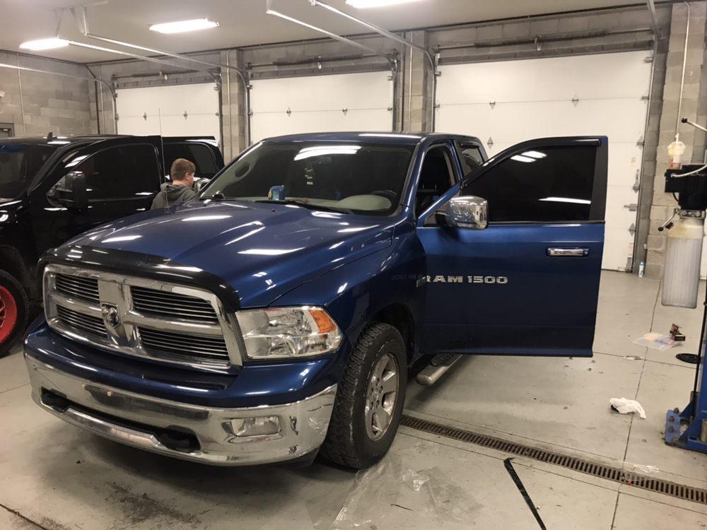 Blue Ram 1500 truck getting window tint